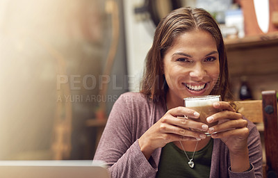 Buy stock photo Portrait of a happy young woman enjoying a cup of coffee at a cafe
