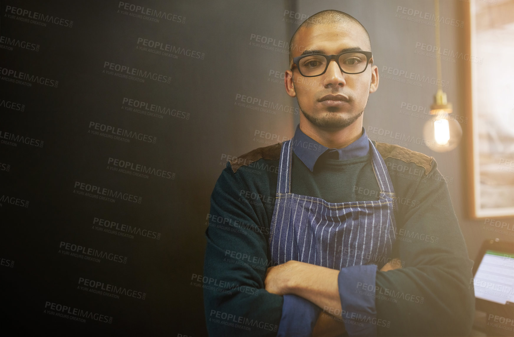 Buy stock photo Arms crossed, glasses and portrait of man in coffee shop for management of restaurant as owner. Apron, flare and mockup space with serious Brazilian person in cafe as hospitality or service employee