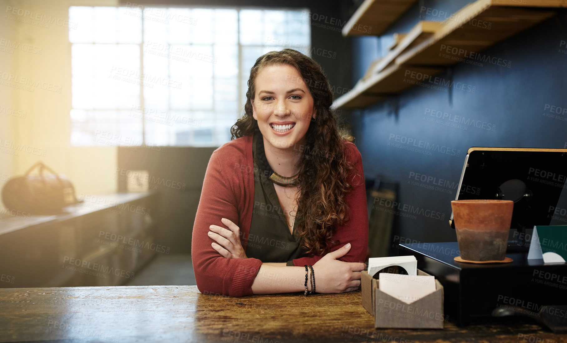 Buy stock photo Portrait of a young business owner standing in her shop