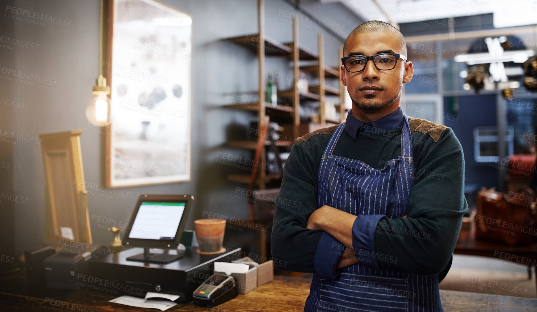 Buy stock photo Arms crossed, man and portrait of artisan in small business for leatherwork, creative manufacturing and handmade crafting. Tanning trade, owner and craftsman by counter for customer service and help