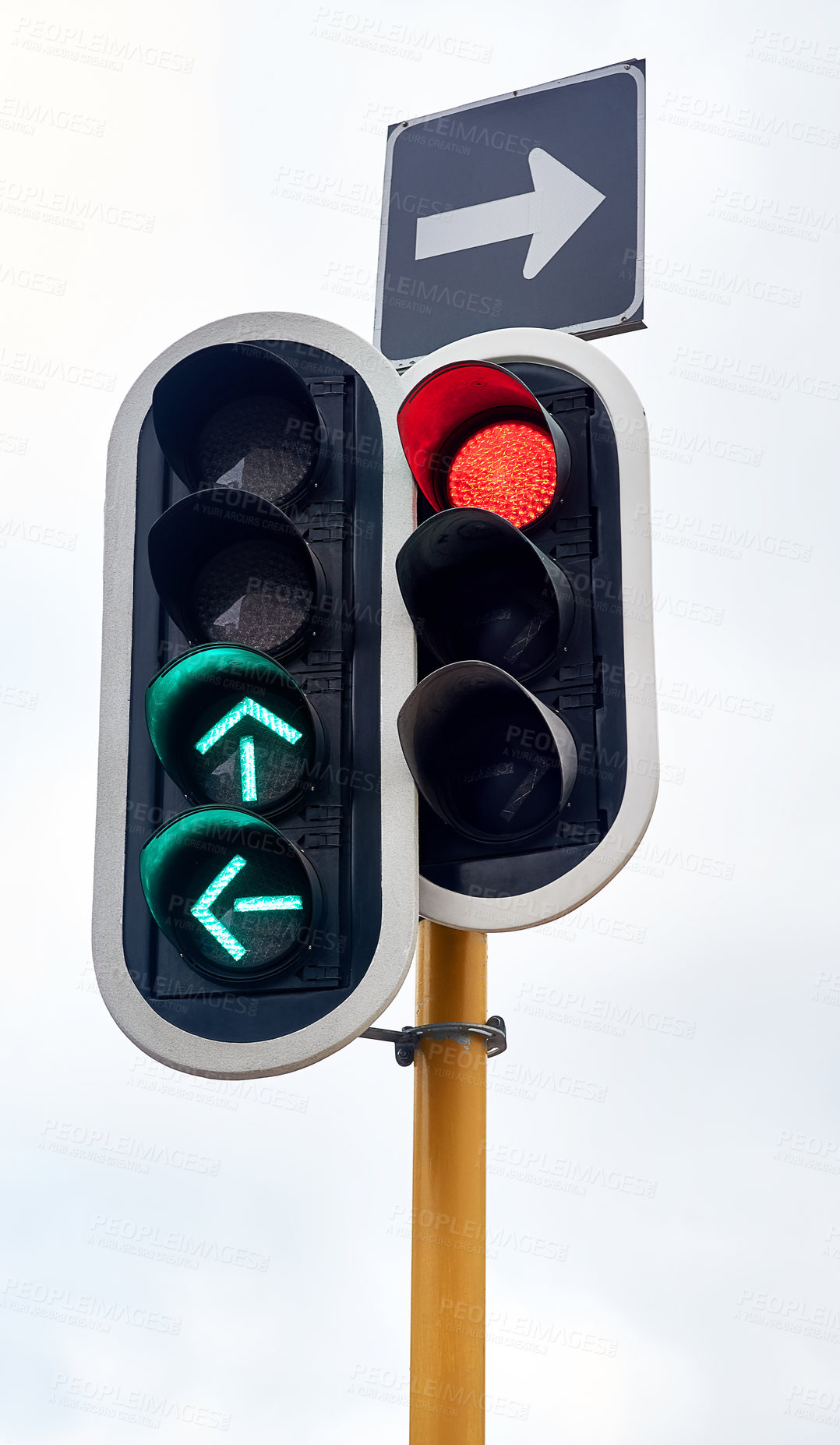 Buy stock photo Shot of traffic lights against a gray sky