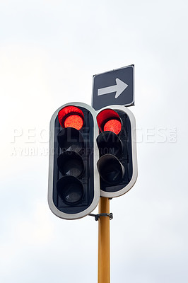 Buy stock photo Traffic light, stop and street rules in city for transport direction or delay, commute or safety. Sign, red and arrow with warning for vehicle driving or urban travel with caution, downtown or road