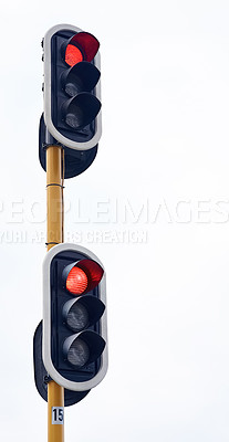 Buy stock photo Shot of traffic lights against a gray sky