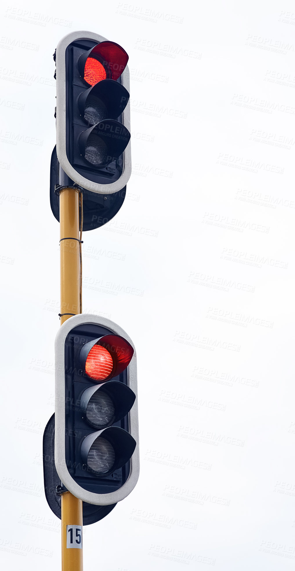 Buy stock photo Shot of traffic lights against a gray sky