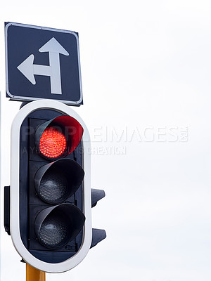 Buy stock photo Shot of traffic lights against a gray sky