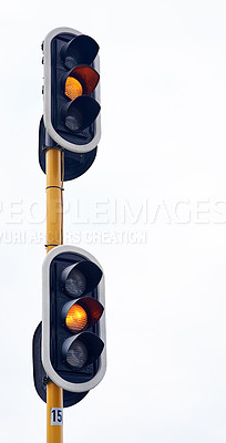 Buy stock photo Traffic light, orange and street caution in city for slow down driving as transport warning sign, junction or rules. Intersection, urban and downtown trip with road safety for wait, delay or commute