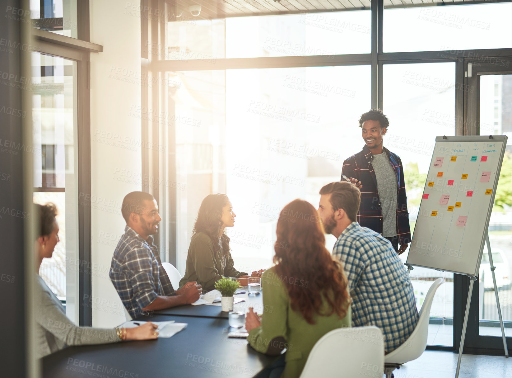 Buy stock photo Cropped shot of coworkers having a meeting in a modern office