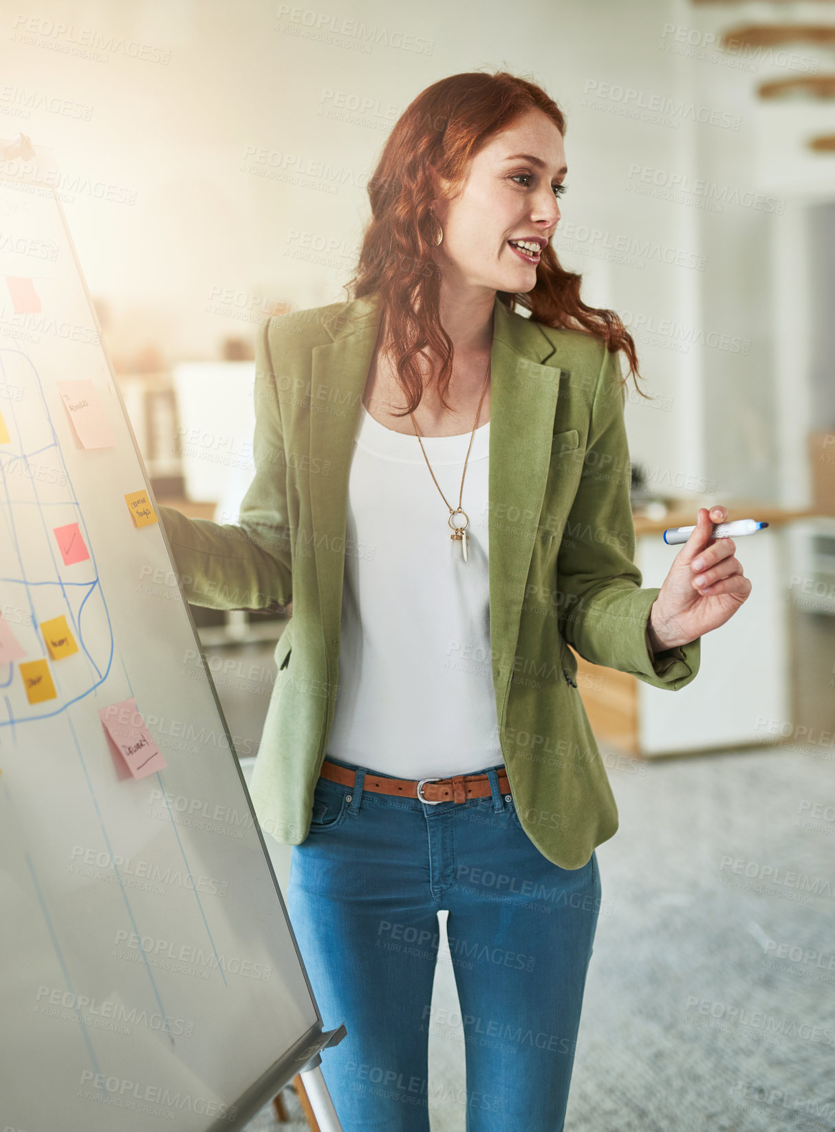 Buy stock photo Cropped shot of a young businesswoman giving a presentation in a modern office