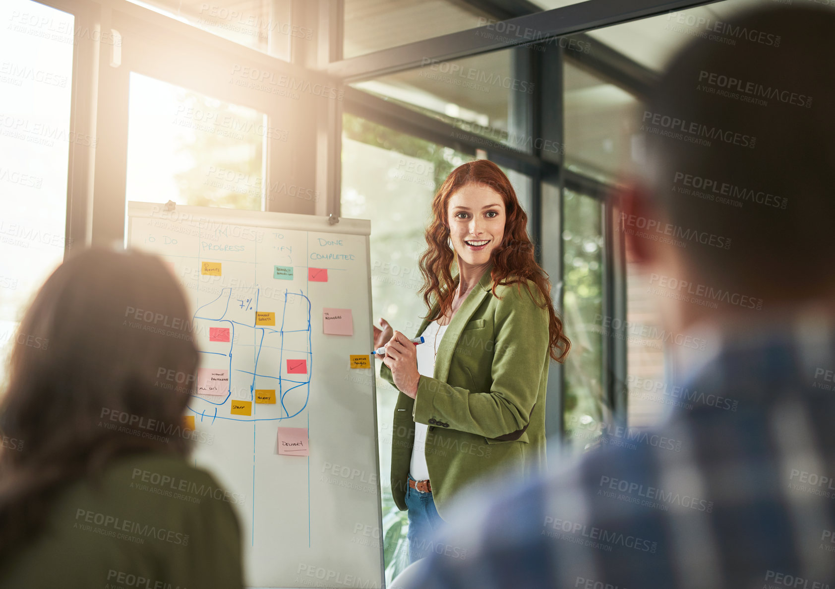 Buy stock photo Cropped shot of a businesswoman giving a presentation to her coworkers in a modern office