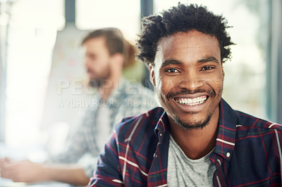 Buy stock photo Portrait of a young businessman sitting in a modern office with his colleagues
