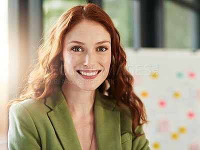Buy stock photo Portrait of an ambitious young businesswoman standing in an office