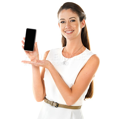 Buy stock photo Shot of a young woman showing you a smartphone while posing against a white background