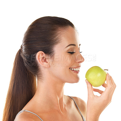 Buy stock photo Woman, health and apple smile in studio on white background for digestion, nutrition and snack. Female person, happy and fruit fresh for organic vegan, food or diet for self care and wellness
