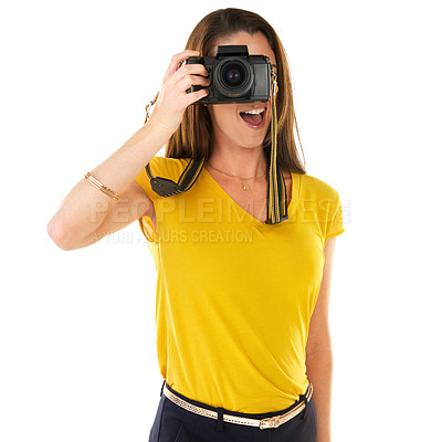 Buy stock photo Shot of a young woman holding her camera against a white background