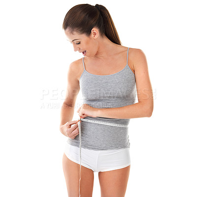 Buy stock photo Woman, body and measure with tape in studio on white background for progress, weight and fat loss. Happy, satisfied with results for fitness, stomach and diet or nutrition with self care or wellness
