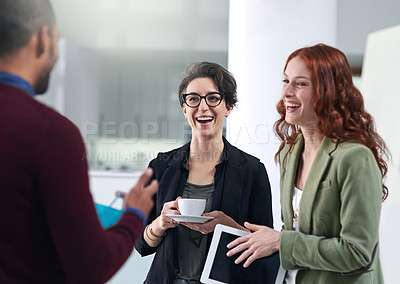Buy stock photo Conversation, laughing and business people in office for teamwork with coffee and tablet. Happy, discussion and group of professional creative designers working, bonding and talking in workplace.