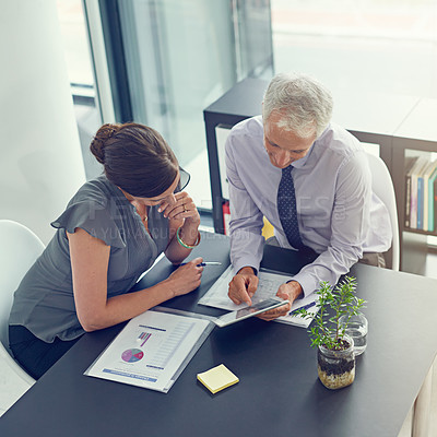 Buy stock photo Business people, meeting and office with tablet, documents and teamwork for discussion or review. Above, woman and man for collaboration, technology and mentorship in project management as employees 