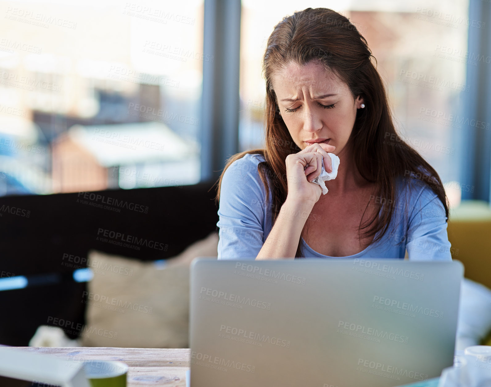 Buy stock photo Cropped shot of a young woman feeling unwell at home