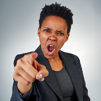 Buy stock photo Portrait of a furious businesswoman yelling and pointing in anger