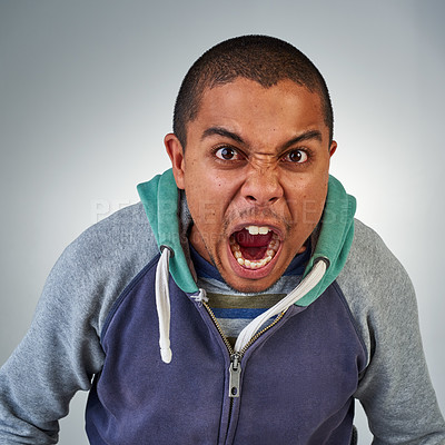 Buy stock photo Portrait, black man and angry in studio for yelling, stress and anxiety. Frustrated male person, mental health and isolated face on grey background with anger problem for burnout, crisis and bipolar