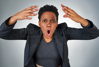 Buy stock photo Portrait of an angry businesswoman yelling against a grey background