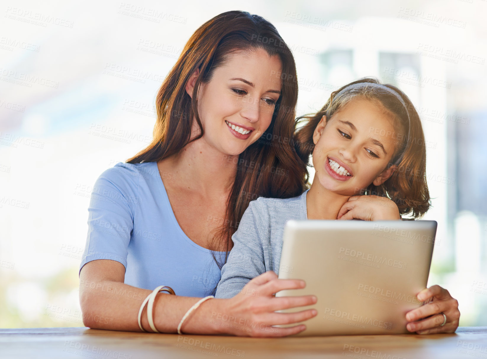 Buy stock photo Happy, tablet and mother with child in home watching online video on app, internet or social media. Smile, love and mom with girl kid streaming movie, film or show on digital technology in house.