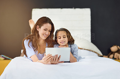 Buy stock photo Relax, tablet and mother with child on bed at home watch online video on app, internet or social media. Smile, love and mom with girl streaming movie, film or show on digital technology in bedroom.