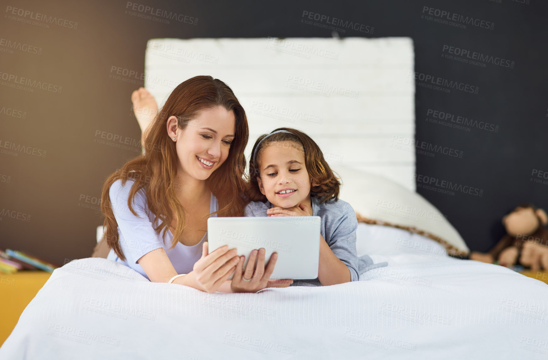 Buy stock photo Relax, tablet and mother with child on bed at home watch online video on app, internet or social media. Smile, love and mom with girl streaming movie, film or show on digital technology in bedroom.