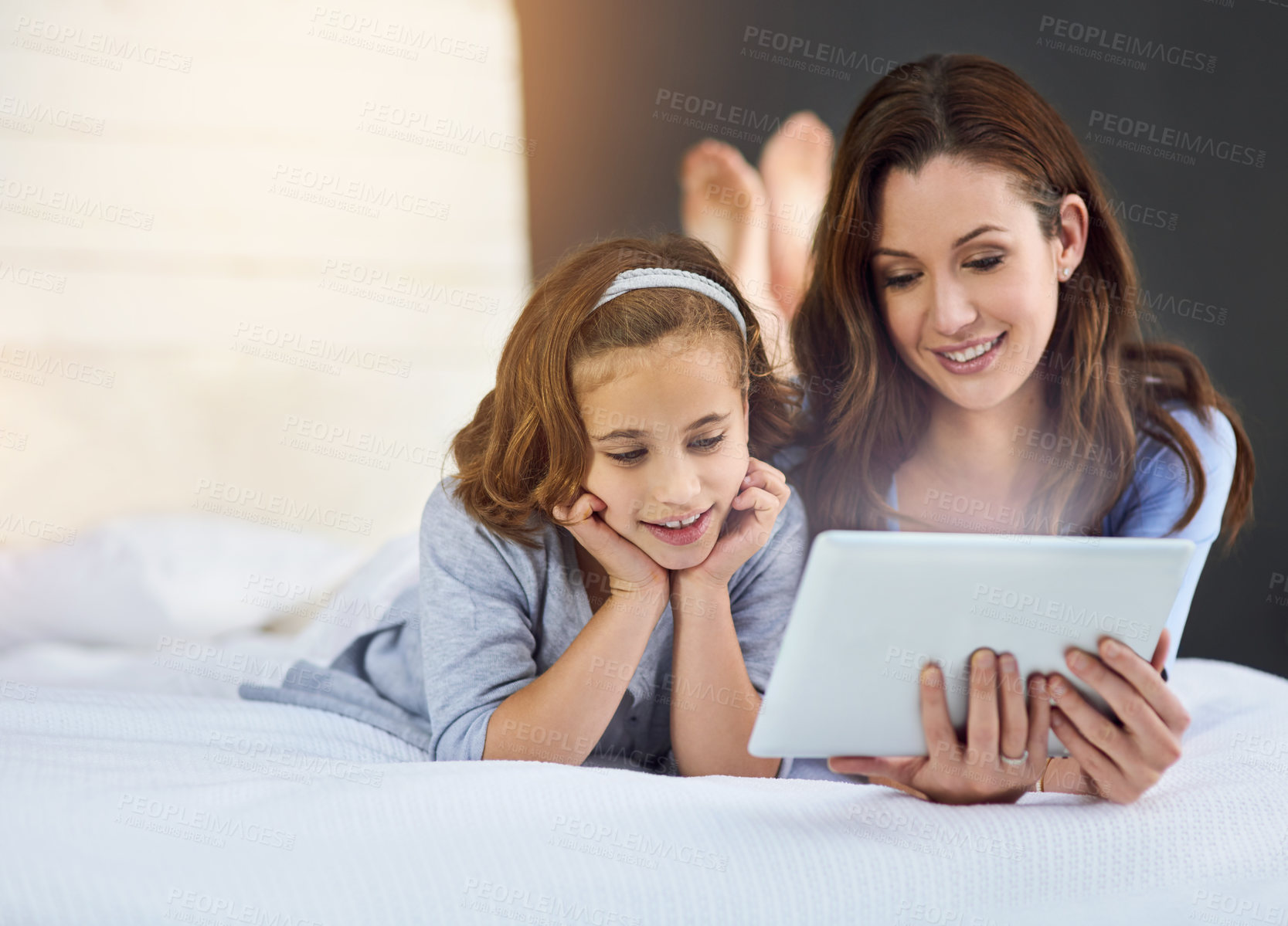 Buy stock photo Relax, tablet and mom with child on bed at home watch online video on app, internet or social media. Smile, love and mother with girl streaming movie, film or show on digital technology in bedroom.