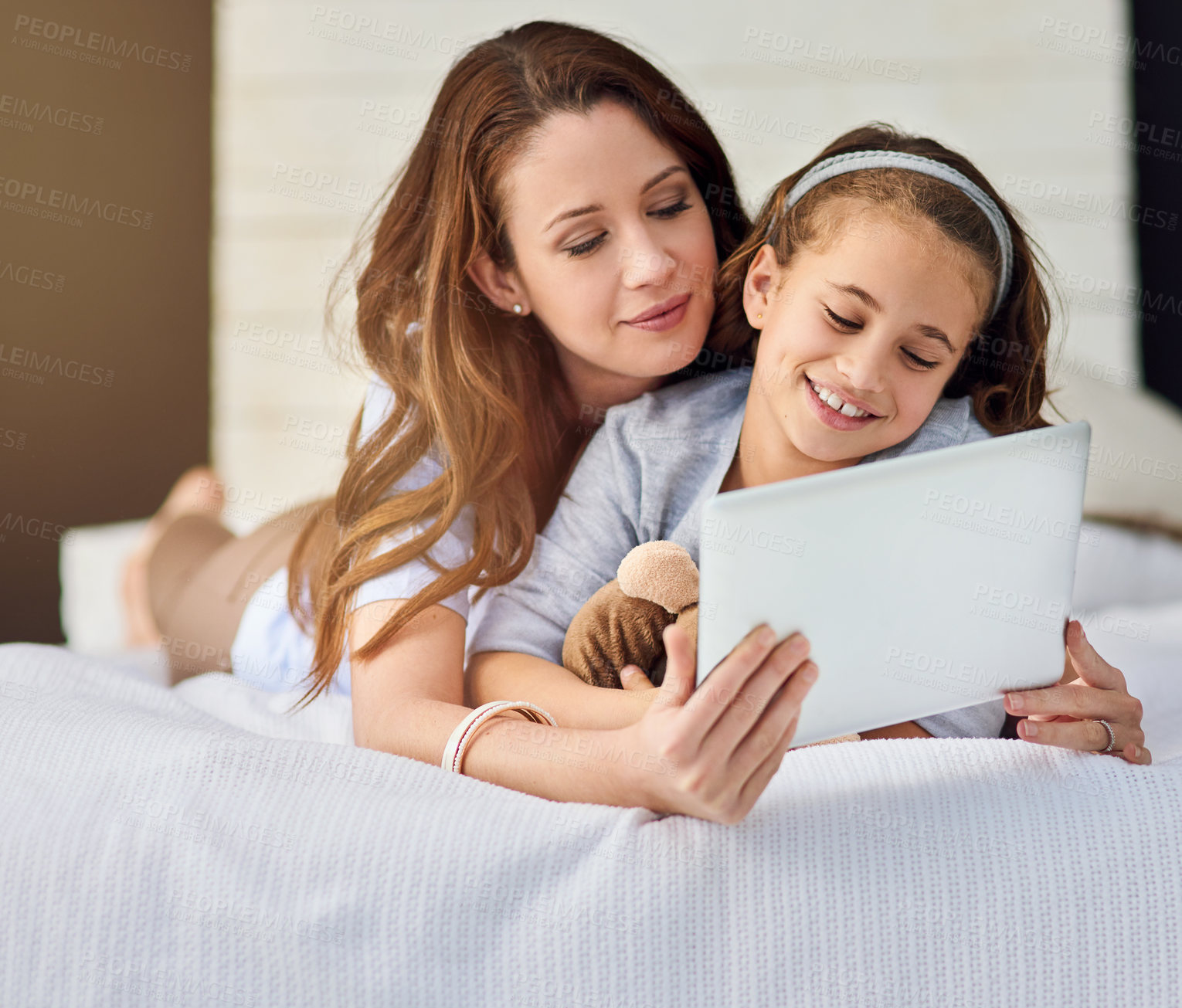 Buy stock photo Relax, tablet and mother with girl on bed at home watch online video on app, internet or social media. Smile, love and mom with child streaming movie, film or show on digital technology in bedroom.