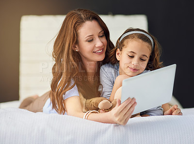 Buy stock photo Relax, tablet and mom with girl on bed at home watch online video on app, internet or social media. Smile, love and mother with child streaming movie, film or show on digital technology in bedroom.