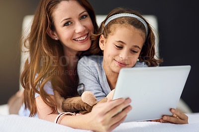 Buy stock photo Portrait, tablet and mother with girl on bed at home watch online video on app, internet or social media. Smile, love and mom with child streaming movie, film or show on digital technology in bedroom