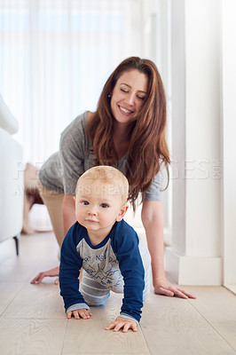 Buy stock photo Mother, child and crawling for development, growth and motor skills in childhood as baby at home. Woman, toddler and play for learning, cognition and support in living room for mobility or balance