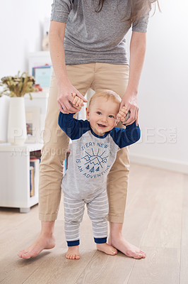 Buy stock photo Mother, child and walking for development, growth and motor skills in childhood as baby at home. Woman, toddler and play for learning, cognition and support in living room for mobility or balance