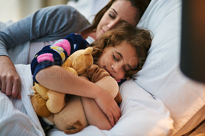 Buy stock photo Cropped shot of a mother and daughter sleeping together in bed