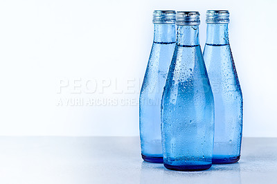 Buy stock photo Bottles of water, studio and mineral liquid for aqua, cold drink and clear or pure tonic for diet. Natural, drink and beverage on white background for nutrition, h2o and collection for hydration