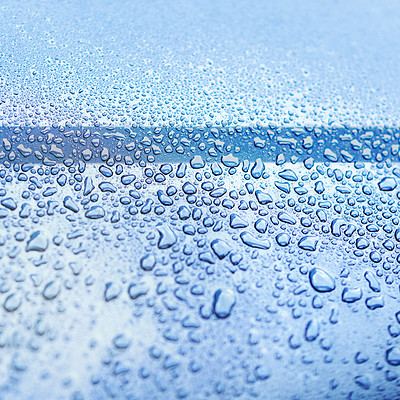 Buy stock photo Water, drops and wet on blue surface in nature for wallpaper, background and textures in environment. Rain, window and liquid on screen for cleaning, glass and close up of smooth exterior in shower