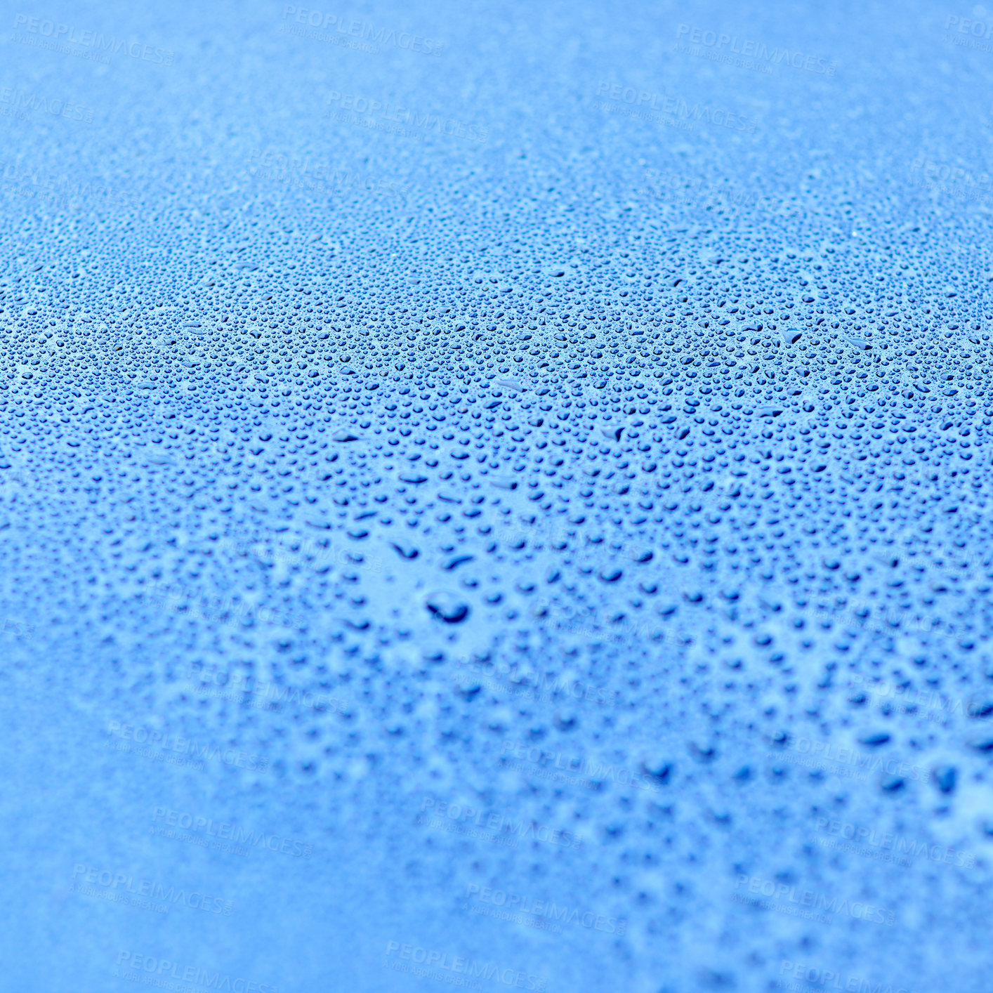 Buy stock photo Shot of drops of water on a smooth surface