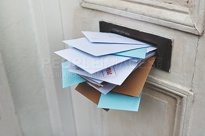 Buy stock photo Door, letter and mail or envelope in box of home for communication or notice, stacked and overflowing with documents. Mailbox, post and address for mortgage or debt, message and paper from bank.