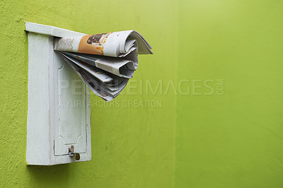 Buy stock photo Cropped shot of newspapers in a letter box