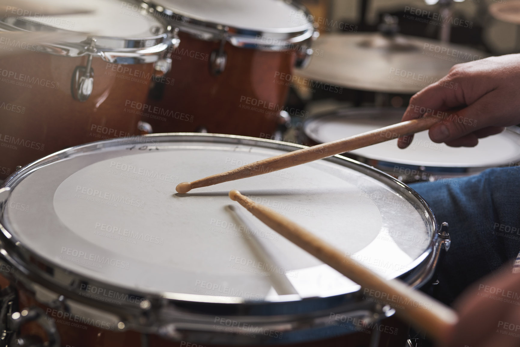 Buy stock photo Cropped shot of an unrecognizable man playing the drums