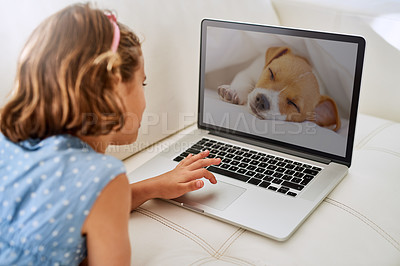 Buy stock photo Cropped shot of a young girl using a laptop at home