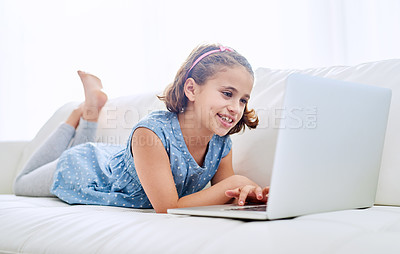Buy stock photo Shot of a young girl using a laptop at home