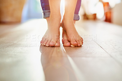 Buy stock photo Closeup shot of a mother and her child's feet together