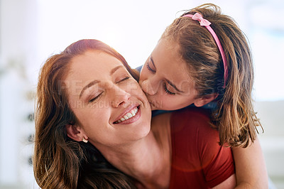 Buy stock photo Mom, girl and kiss with smile in family home for love, trust and bonding together on mothers day. Woman, child and happy in living room with affection for support, appreciation or gratitude at house