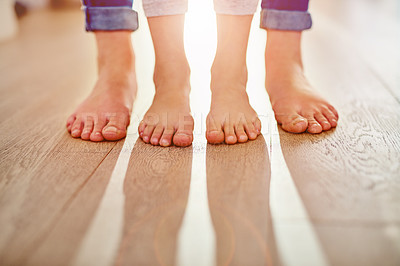 Buy stock photo Closeup shot of a mother and her child's feet together