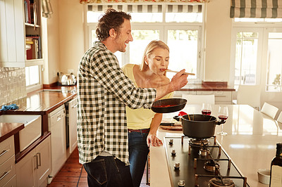 Buy stock photo Taste, happy or couple kitchen cooking with healthy food for lunch or dinner together at home in Sydney. Laughing, love or woman eating or smiling with mature husband in meal preparation in Australia