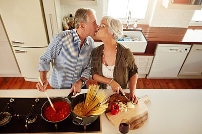 Buy stock photo Top view, kiss or old couple kitchen cooking with healthy food for lunch or dinner together at home. Love, help or senior woman bonding or kissing mature husband in meal preparation in retirement