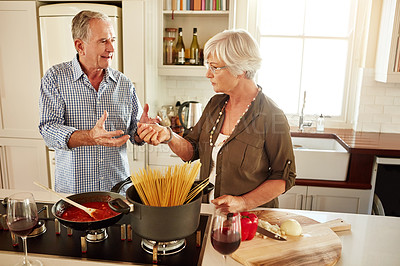 Buy stock photo Talking, food or old couple in kitchen cooking with healthy vegetables for lunch meal or dinner together. Spaghetti or woman helping or speaking to mature husband in meal preparation in retirement