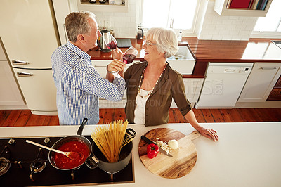 Buy stock photo Romance, wine or happy old couple cooking food for a healthy vegan diet together with love in retirement. Romantic senior woman drinking or bonding in house kitchen with mature husband at dinner 
